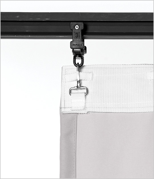 A curtain with webbing and snap hooks
