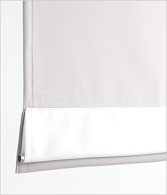 The bottom of a curtain with a pipe pocket
