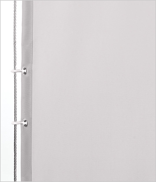A jib clamp on the side of a curtain