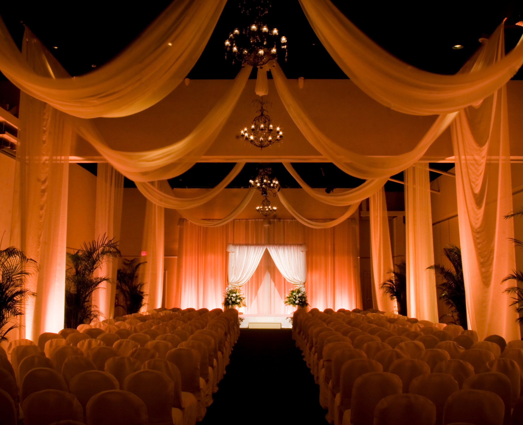 Elegant voile drapery installation for a special event