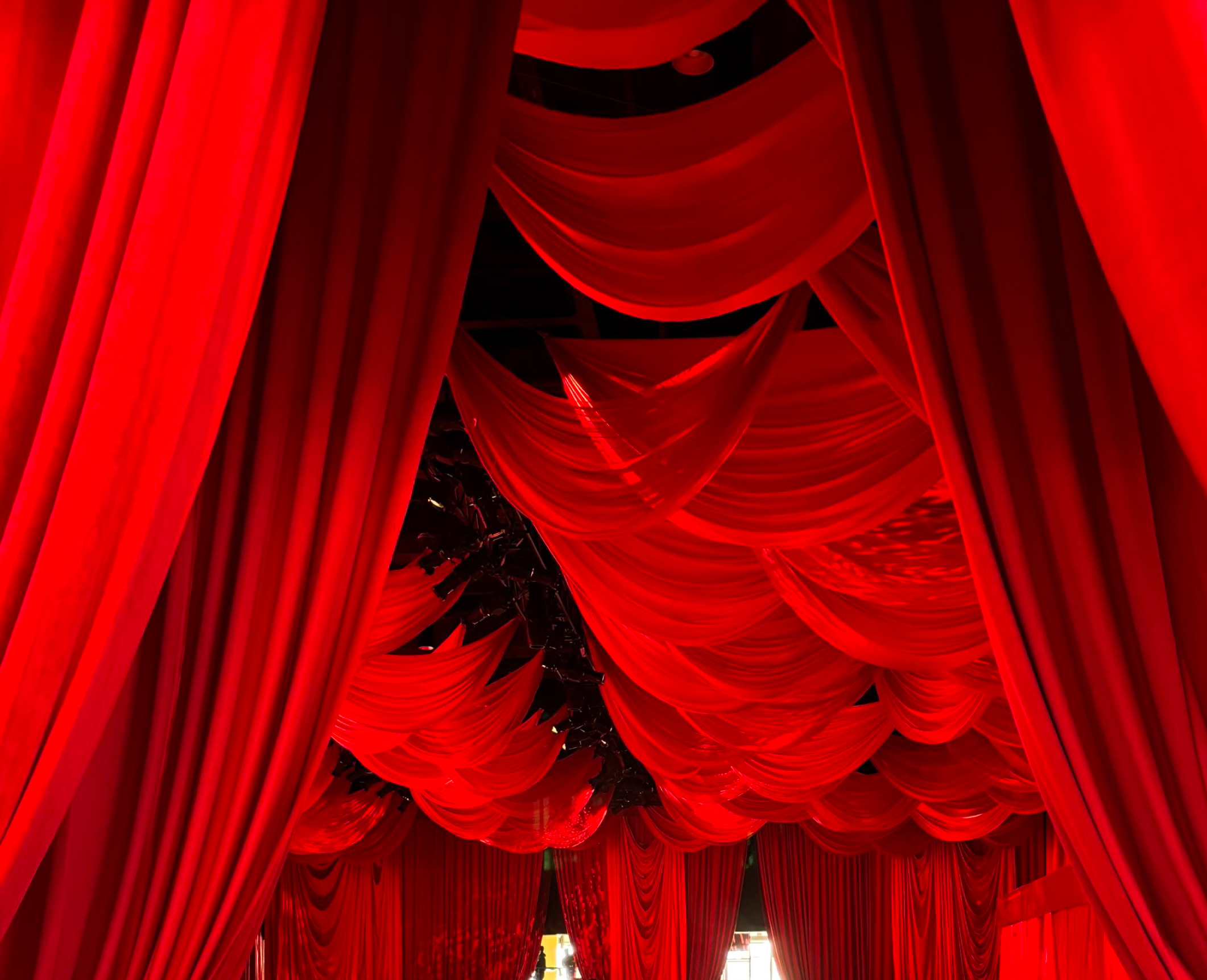 Charmeuse drapery panels installed for an event production